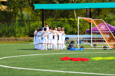 Youth players learning soccer skills at a Fundación Real Madrid camp
